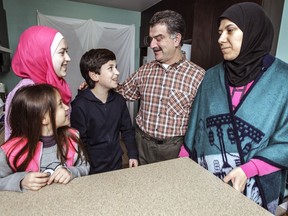 Syrian refugees Al Fadel Mofti and wife Bushra Meek with their children Ghina, Nour and Mohammad in St-Polycarpe, west of Montreal, last December.