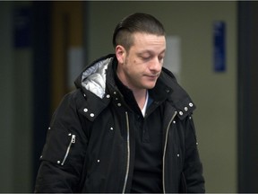 Jonathan Mignacca leaves a Laval courtroom Jan. 27, 2015, after he was found guilty of discharging a firearm while he acted as Raynald Desjardins' bodyguard.