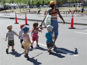 Children from a daycare centre head to the water fountains at Place des Arts. The city of Montreal has unveiled a new policy designed to address the needs of children.