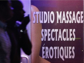 A sign on the door of a massage parlour in downtown Montreal, Thursday July 12, 2012.