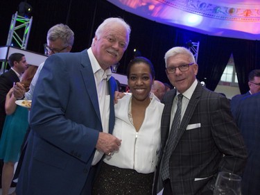 Hockey legend Yvon Lambert, reporter Martine St-Victor, and Réjean Houle at a Grand Prix party at the Ritz Carlton in Montreal, Friday, June 10, 2016.