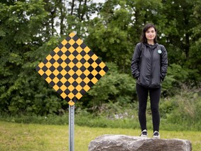Cathou Dupuis ends her walk from downtown Montreal to the Antoine-Faucon entrance of L'Anse-a-l'Orme nature park in Montreal on Sunday June 12, 2016. Dupuis walked to protest a proposed residential development slated for the area called Pierrefonds West.