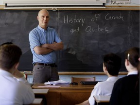 History teacher Robert Green answers pre exam review questions with his students at Westmount High School.