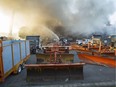 Firefighters battle a blaze at a public works building in St-Laurent June 15, 2016. The cause if the fire is being investigated.