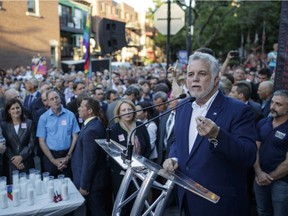 Quebec Philippe Couillard speaks during a vigil at Parc de l'Espoir in Montreal to honour the victims of the June 11/12 shooting attack at the gay nightclub Pulse in Orlando, Florida, on Thursday, June 16, 2016.