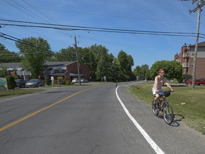 Cyclist David Lynch enjoys the sunny warm weather as he rides along Duhamel Road between Cardinal Léger Blvd. and 5th Ave. in Pincourt.