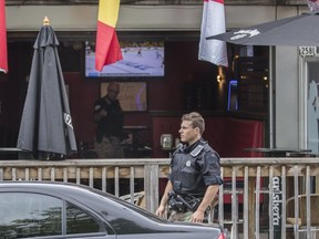 Montreal police at the scene where 72-year-old Angelo D'Onofrio was shot inside the Sinatra Café near the corner of Fleury and André Jobin streets in Montreal on Thursday, June 2, 2016.