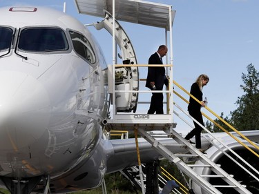 Alain Bellemare, left, CEO of Bombardier, and Catherine Beaudoin exit a CS 100 jet as Bombardier prepares to deliver the new plane to Swiss Air in Montreal on Wednesday June 29, 2016. Catherine Beaudoin is the daughter of Pierre Beaudoin, executive chairman of the board of Bombardier.