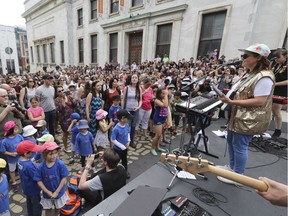 Ariane Moffatt (right) and her band play a short set of music on du Musée Ave. in Montreal Friday, June 3, 2016 as a way of inaugurating a new installation by architect Jean Verville entitled "Plancher de danse – Dance Floor." This was beside the Montreal Museum of Fine Arts.