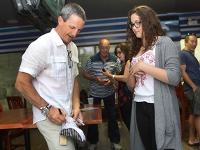 Former Canadiens captain and coach Guy Carbonneau signs autograph for fan at Les Quatre Glaces Brossard on June 4, 2016 at the Scotiabank Pro-Am for Alzheimer’s hockey tournament, benefiting the Jewish General Hospital.