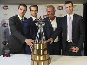 Former Montreal Canadiens great Guy Lafleur, second from right, poses with recipients of the annual Guy Lafleur Awards of Excellence and Merit for young hockey players at the Bell Centre in Montreal Tuesday, June 7, 2016. From the left are: Alexis D'Aoust of the Shawinigan Cataractes, Charles-David Beaudoin of the Université du Québec à Trois-Rivières Patriotes and Philippe Boisvert of the Champlain Regional College Cougars.The awards are given to amateur level players with the best combination of hockey performances and academic excellence.