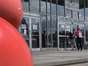Two women look inside the Montreal Science Centre in the Old Port to find out why the doors are locked on June 7, 2016.  A strike by nearly 280 federal employees has led to the closure of the science centre, as well as the Clock Tower Beach and Port d’Escale marina.