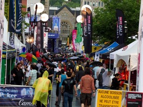 MONTREAL, QUE.: JUNE 8, 2012--The street remains full despite rain during the annual Crescent Street street festival for the Canadian Formula One Grand Prix in Montreal on Friday June 8, 2012.  (Allen McInnis / THE GAZETTE)