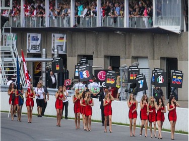Models walk off the starting grid F1 before the 2013 Formula One Canadian Grand Prix. F1 continues to leave itself open to criticism for employing curvy “grid girls” — paid models — to do little more than stand there and look pretty.