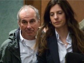 Alleged Cinar fraudster Ronald Weinberg, left, walks out of courtroom May 12, 2014.