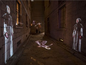 Cité Mémoire’s large-scale video projections include Foundlings Quay / 1750. Projected in an alley, the Ruelle Chagouamigon, it depicts the Sisters of Charity (also known as the Grey Nuns), who accepted abandoned children and cared for young unwed mothers.