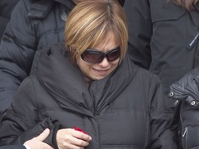 Francesca Montagna leaves a Montreal church after the funeral of her husband, Salvatore Montagna, in November 2011.