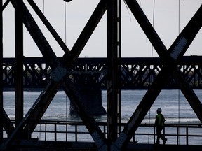 Construction crews work tirelessly attempting to repair and maintain Montreal's crumbling Mercier bridge.