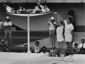 Sandra Henderson and Stéphane Préfontaine light the Olympic flame during the opening ceremony for the 1976 Summer Olympic Games in Montreal.