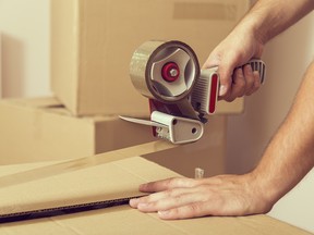 stk Stock photo of someone packing boxes.