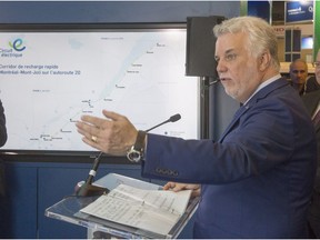 Quebec Premier Philippe Couillard announces a new electric vehicle charging corridor between Montreal and Mont-Joli at the Electric Vehicle Symposium, Monday, June 20, 2016 in Montreal.
