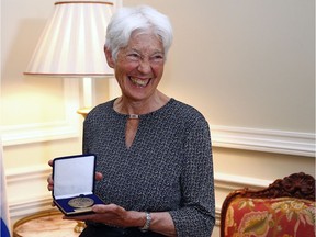 Activist Kathleen Ruff smiles after receiving the medal of honor at the Salon du President at the National Assembly in Quebec City on Thursday June 9, 2016.