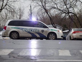 REPENTIGNY, QUE.: NOVEMBER 24, 2011-- Police block the road to Ile Vaudry, the small island where Salvatore Montagna was killed in the municipality of Charlemagne, near Repentigny on Thursday, November 24, 2011. Police say Montagna was attempting to take over the mafia in Montreal. (Dario Ayala/THE GAZETTE)