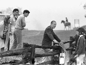 Prince Philip gives Princess Anne a few words of advice while Queen Elizabeth, Prince Charles and Prince Andrew listen in prior to her starting in the cross-country three day equestrian event at Bromont, Quebec.