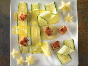 Anne Fortin's latest cookbook, Salade, stresses fresh ingredients used imaginatively. Here, salmon bites sweetened with honey are served over a trellis of thinly sliced zucchini.