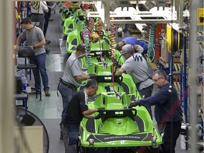 Employees work on a Sea-Doo assembly line at the BRP plant in Valcourt in 2014.
