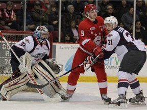 Windsor Spitfires defenceman Mikhail Sergachev, right battling Soo Greyhounds' Zachary Senyshyn in front of netminder Mario Culina, had 17 goals and 40 assists in 67 games last season.