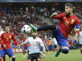 Spain's Sergio Ramos reaches for the ball during the Euro 2016 Group D soccer match between Spain and Turkey at the Allianz Riviera stadium in Nice, France, Friday, June 17, 2016.