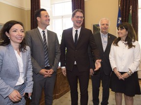 Quebec Opposition and Parti Quebecois interim leader Sylvain Gaudreault, centre, poses with Parti Québécois leadership hopefuls Martine Ouellet, from left, Alexandre Cloutier, Jean-Francois Lisée, and Véronique Hivon at his legislature office, Wednesday, June 1, 2016 in Quebec City.