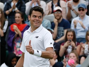Canada's Milos Raonic celebrates beating Italy's Andreas Seppi during their men's singles second round match on the fourth day of the 2016 Wimbledon Championships at The All England Lawn Tennis Club in Wimbledon, southwest London, on June 30, 2016.
