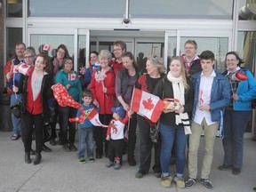 Members of the Gananoque Refugee Resettlement Group gather outside Kingston Airport before greeting a Syrian refugee family. Like Katharine Cukier and her friends in Montreal, Canadians across the country have banded together to sponsor Syrian refugees.