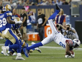 Montreal Alouettes' Duron Carter (89) dives for extra yards against the Winnipeg Blue Bombers during the first half of CFL action in Winnipeg Friday, June 24, 2016.