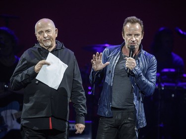 English musicians Peter Gabriel, left, and Sting, right, speak to the audience during their performance at the Bell Centre in Montreal as part of their Rock Paper Scissors tour on Tuesday, July 5, 2016.