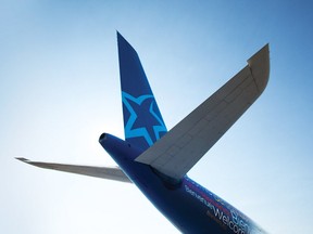 December 20, 2011--  Air Transat has a new colour scheme: the Welcome mosaic, the star on the tail and the blue rear fuselage.