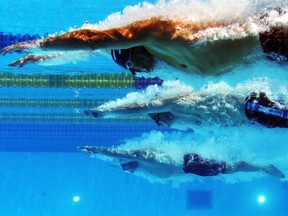 Swimmers compete in the Men's 200m Individual Medley at Parc Jean-Drapeau during the 15th FINA World Masters Championships on Aug. 6, 2014.