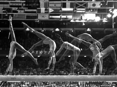 A multiple-exposure photo shows Nadia Comaneci performing her part of the balance beam routine in the Montreal Summer Olympic Games on July 23, 1976.