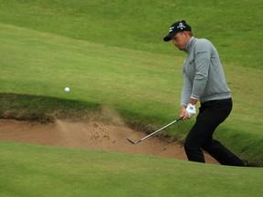 Henrik Stenson of Sweden plays a shot from a bunker on the 16th hole during the third round on day three of the 145th Open Championship at Royal Troon on July 16, 2016, in Troon, Scotland.