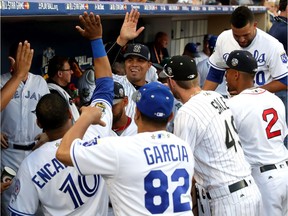 Dellin Betances (#68) of the New York Yankees and the American League is congratulated after coming out of the game during the 87th Annual MLB All-Star Game at PETCO Park on July 12, 2016 in San Diego, California.