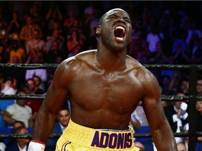 Adonis Stevenson of Montreal celebrates after defeating Thomas Williams Jr. of the US. during their WBC light heavyweight championship fight on Friday, July 29, 2016 in Quebec City.