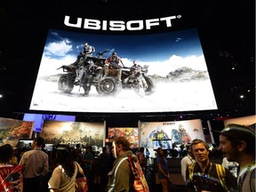 Gamers walk in the Ubisoft  booth to try out new video games during annual E3 Gaming Conference at the Los Angeles Convention Center on June 14, 2016 in Los Angeles, California.