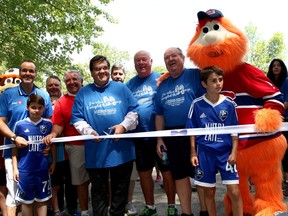 Those taking part in the Procure Walk of Courage included (from left) Joey Saputo and son Jesse; walk co-founder Jean Pagé; Lino Saputo, prostate cancer survivor; Montreal Mayor Denis Coderre, the walk's honorary president; Cédric Bisson, president of the Procure board; walk co-founders Robin Burns and Father John Walsh; Iñaki Sastron-Navarrete, member of the Montreal Impact Academy.