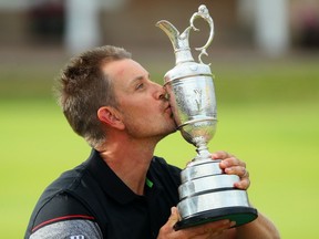 Henrik Stenson of Sweden celebrates victory as he poses with the Claret Jug on the the 18th green after the final round on day four of the 145th Open Championship at Royal Troon on July 17, 2016, in Troon, Scotland. Henrik Stenson of Sweden finished 20 under for the tournament to claim the Open Championship.