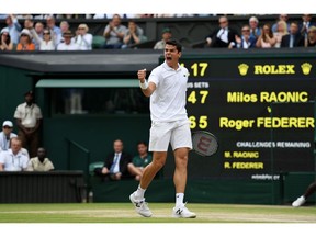Canada's Milos Raonic reacts after winning point during Wimbledon men's semi-final match against Roger Federer on July 8, 2016 in London, England. Raonic won the match in five sets.