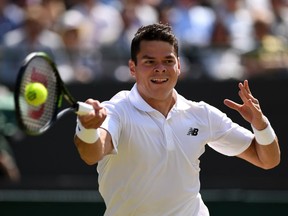 Milos Raonic of Canada plays a forehand during the men's singles quarter-final match against Sam Querrey of the U.S. at Wimbledon on July 6, 2016 in London, England.