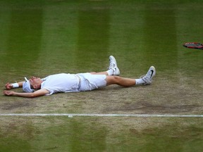 Denis Shapovalov of Canada celebrates victory during the Boy's Singles Final against Alex De Minaur of Australia on day thirteen of the Wimbledon Lawn Tennis Championships at the All England Lawn Tennis and Croquet Club on July 10, 2016 in London, England.