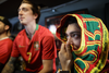 Soccer fans Joao Vaz, right, and his brother Benjamin Vaz, left, watch the UEFA Euro 2016 final at Champs Sports Bar on St. Laurent boulevard in Montreal on Sunday, July 10, 2016.